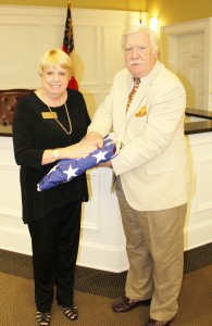 Councilwoman Diane Krause and Mayor Pro Tem Tom Witts with the American flag given to the city by Krause’s brother, retired Navy Lt. Thomas A. Chorlton.  Click image to see larger photo