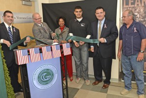 At the ribbon-cutting of the GGC Military and Veterans Success Center are John Maison, president of the GGC student organization Coalition of Veteran Engagement, Readiness and Trust; Dr. Stas Preczewski, GGC president; Dr. Lois C. Richardson, provost; Aizaz Shaick, GGC student volunteer; Dr. David Snow, director of Military Affairs with the University System of Georgia; and Paul Reato, representative of the family of Deborah Reato.