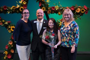 Angel Esquivel (third from left) stands with Dr. Glen Cannon, president of Gwinnett Technical College, flanked by her faculty advisors, Amy Weaver(left) and LeaAnna Harding (right). (Photo by Anthony Stalcup)