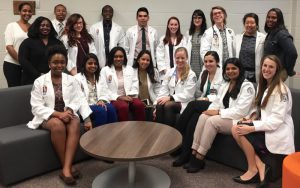 GA-PCOM students traveled to Emory to watch the high schoolers present "The Total Package: holistic Health from a Kid's View." From left are, seated, Valencia Oglesby, Sunita Jena, Kita Mack, Lakshmi Rao, Anna Nay, Morgan Myers, Sara Khalid and Francesca DiSantis. Standing are Daryllynn Patterson, Dominque Lewis, Ra'Shead Pompey, Catlyn Thigpen, Anthony Kamson, Nick Hernandez, Morgan Zegers, Yasmeen Shariff, Jeremiah Arnold, Hannah Shin and GA-PCOM Director of Student Affairs Patience Mason.