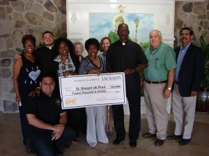 A $12,000 Jackson EMC Foundation grant to St. Vincent de Paul at St. Patrick’s Catholic Church in Norcross will help fund emergency financial assistance for housing. Jackson EMC Foundation board chair Beauty Baldwin (center) and Jackson Foundation board member Jim Puckett (second from right) presented the grant check to Pastor Father Rev. Refugio Onate, Parochial Vicar; Rev. Branson Hipp, Deacon Bill McKenzie; Jeanette Fermin, St. Vincent de Paul President; Rose Deslauries, Treasurer; and caseworkers Lorie Monroe, Alicia Morin and Danny Sequiera.