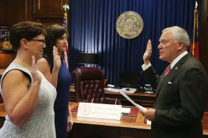 Being sworn in to a state board member are Hospice Medical Director for Affinis Hospice-Augusta, Sharon Beall, M.D., and Gwinnett County Senior Services Manager Jamie Cramer, taking the oath from Governor Nathan Deal. Also appointed to the board was Dr. Tammie E. Quest, director of the Emory Palliative Care Center for Emory’s Woodruff Health Sciences Center.