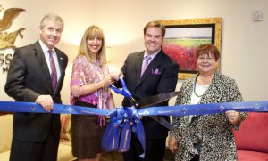 U.S. Rep. Rob Woodall, Shawn and David Cross, and County Commission Chairman Charlotte Nash at the U.S. Asset Management ribbon cutting.