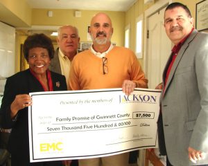 Family Promise of Gwinnett County’s Executive Director Chuck Ferraro (second from right), accepts a $7,500 Jackson EMC Foundation grant check from =Foundation chair Beauty Baldwin, board member Jim Puckett and Jackson EMC District Director of Office Services John Taylor.
