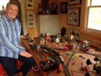 Johnny Day enjoys an HO Gauge model railroad that was built by his father in a separate back yard Train House.