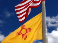The U.S. flag atop the flag of New Mexico, via Wikipedia.