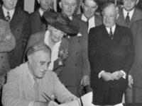 Roosevelt signs the GI Bill in 1944.  George is standing behind the U.S. Rep. Edith Rogers, R-Mass., and has a handkerchief in his pocket.  Photo via U.S. Senate.