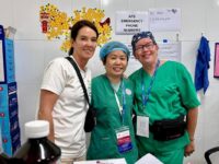 Paige Havens (right) stands alongside Rotary Club of Saigon President Kieu Vuong Nguyen (center), and Alliance for Smiles Can Tho Mission Director Tina Fischlin (left) as they serve patients and their families in the recovery ward post-surgery.