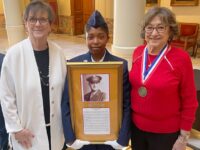 The late World War II Sgt. Carvis Williams of Snellville is among the 177 in the Georgia Military Veterans Hall of Fame. His daughters, Joan Ottinger left and Martha Cooper, are between a Junior ROTC Cadet at ceremonies recently for the hanging of the plaques with citations at the Capitol. 