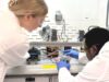 At work in the laboratory are Faith Carlisle (left), Claude David Mbemba (right). Provided.
